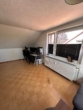 Wohnzimmer 1 - Schnucklige 1,5 Zimmer DG-Wohnung im wärmegedämmten Haus in Norderstedt Garstedt zu vermieten !!