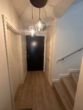 Flur EG mit Versorgungsraum - Neubau !! Exklusives 4 Zimmer Endreihenhaus mit Gartenanteil in Kaltenkirchen zu vermieten !!