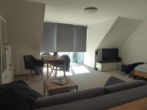 Wohnzimmer - Trendige 1 Zimmer Neubau-Wohnung mit Balkon und Carport in Bönningstedt zu vermieten !!!